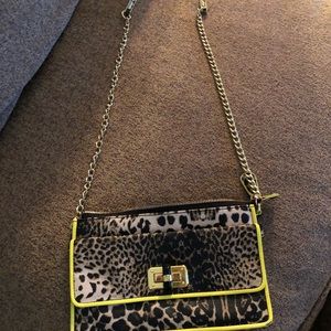Leopard print leather bag with neon yellow trim